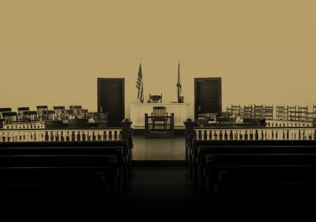Sepia image of a courtroom with the words 'Harper Lee's To Kill A Mockingbird’