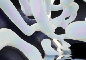 'Making with' 2021 Film still. An abstract image of white tube like forms against a dark background 
