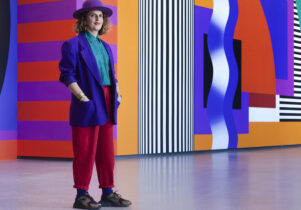 Camille Standing on Promenade in front of her installation.
