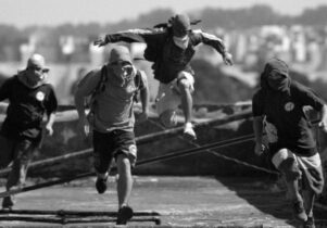 The 4 protagonists running across the rooftops 