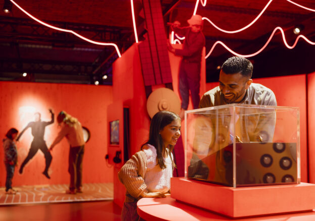 Father and daughter looking at a sundial display in Horrible Science: Cosmic Chaos