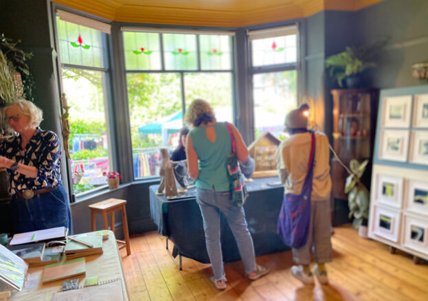 Visitors browsing the open houses at Green Walk