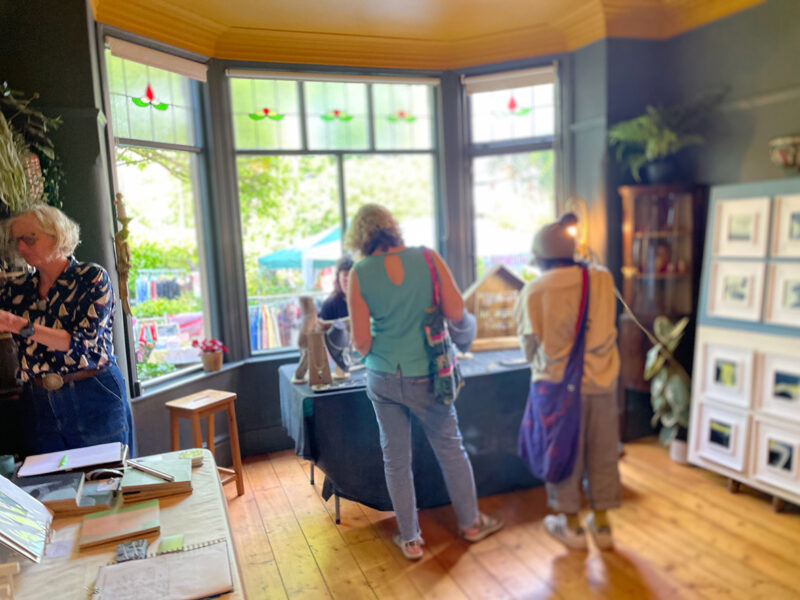 Visitors browsing the open houses at Green Walk