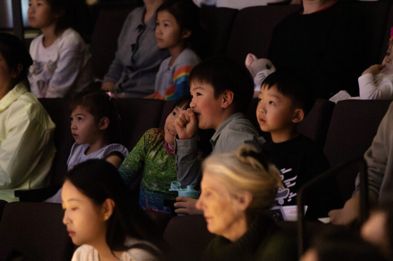 Children watching performance