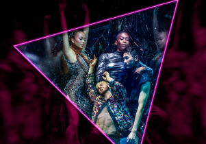 The cast of It's a Sin dance in a club like setting in bright glittery clothes.