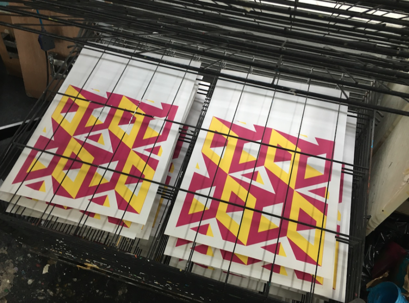 Screen prints on a rack