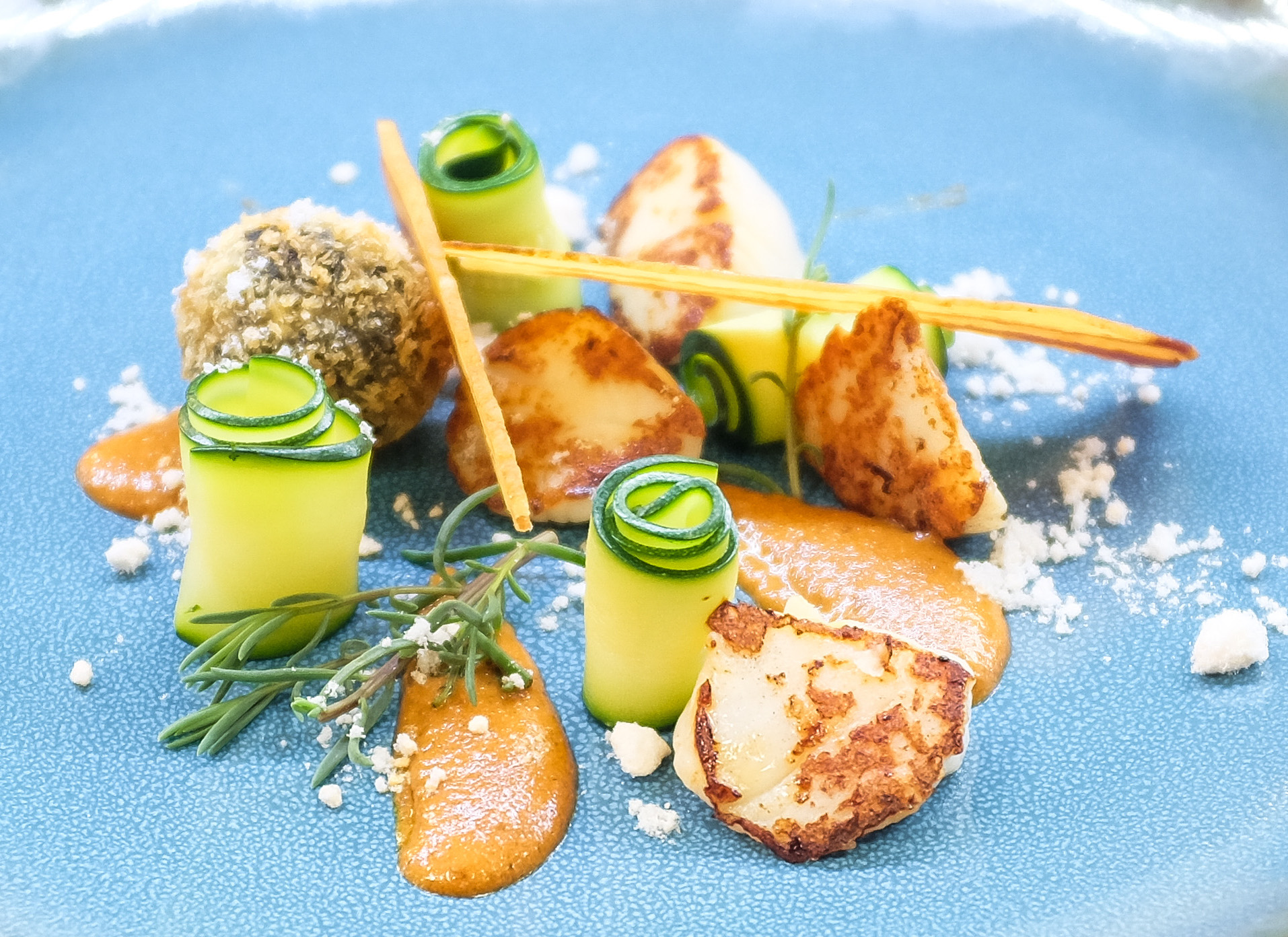 Seared scallops, black pudding bon bon, courgette, proscuitto, chorizo puree