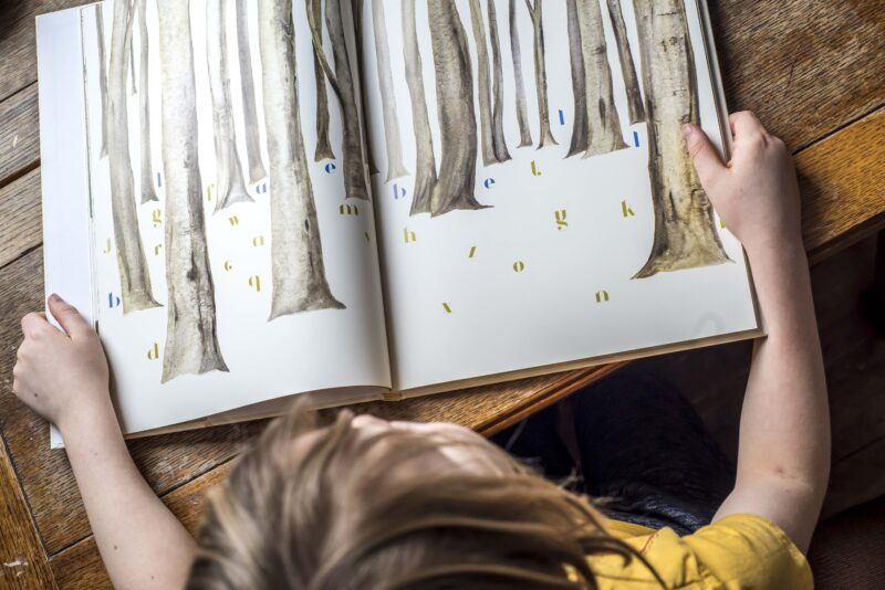 Child reading The Lost Words courtesy Chris Payne