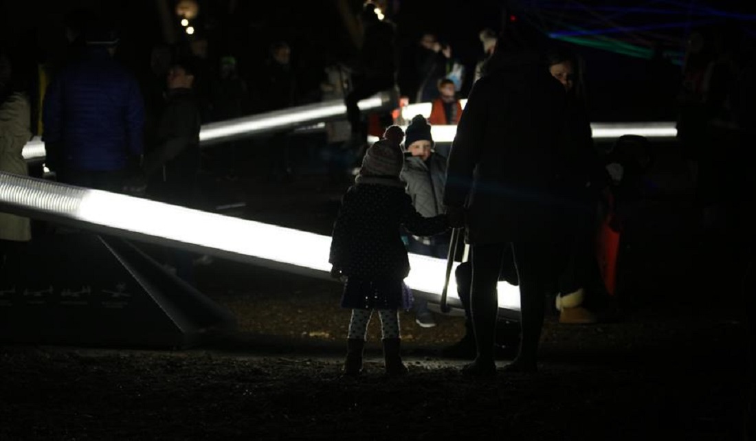People on light up seesaw as part of Wave-Field exhibit