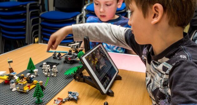 Boy handling Lego during the Lego animation workshop at Manchester Animation Festival