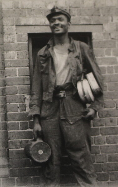 Black miner in old photograph from Digging Deep exhibition